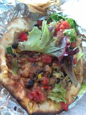 Inside a spicy garden taco (2 per order)...added vegan cheese and meatless crumbles at DellzVille in Charleston