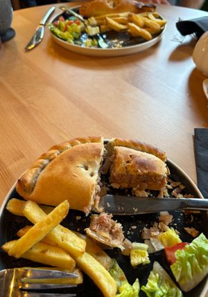 Sorry that the food is half eaten, I was hungry lol but still wanted you to see the inside of the pasties (full of filling😄) and the shared chips and salad. at Crank Cafe @ Crank Studios in Morley
