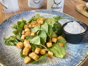 Potato and spinach stir-fry with tomatoes, croutons and vegan sour cream   at Platzhirsch in Pforzheim