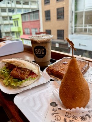 Vegan Tofu burger, cappuccino with plant based milk and vegan cozinha.   at 89ºC Coffee Station in Sao Paulo