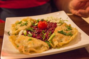 Pirogi filled with mushrooms and sauerkraut, besides a beetroot salad with garlic at Wondergood in Frankfurt