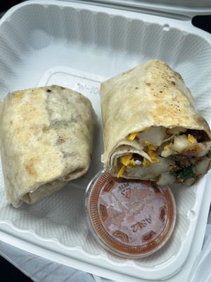 Breakfast burrito minus egg, with vegan cheese, home fries, spinach and salsa  at Busy Bean Cafe in Victor