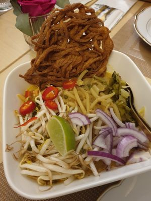 Wok curry noodles with mungbeans, chili, lime, onions, cabbage and seitan. And a deep fried noodle crispy. at Sweety Siam in Bad Aibling