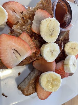 Vegan coconut banana French toast with strawberries added!  at Griddle 145 in Allentown