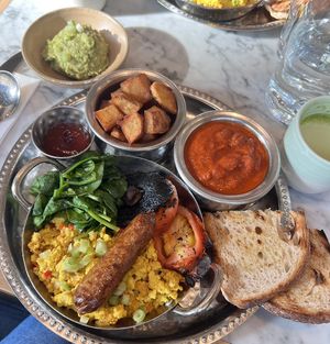 vegan Full English breakfast, guacamole & matcha latte  at Mildreds - Victoria in South West London