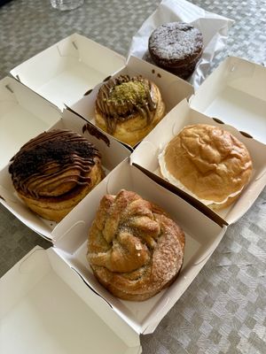 2 cinnamon roll (pistatxo & txokolate), bomba bat, rollo de cardamomo, pastas de higos.  at AMONA Basque Vegan food in Pamplona