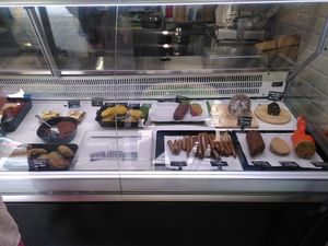 Glass cabinet inside the store with all the goodies! at Bezmasna in Prague