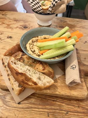 Hummus with sourdough and veggies   at Quinoa in Barcelona