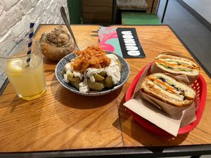 House-made ginger ale, kimchi patatas bravas, "banh mi". at Quinoa in Barcelona