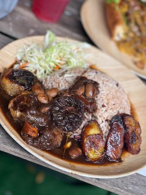 Vegan Oxtail Meal

100% Plant-based Vegan Oxtail served with rice/peas and cabbage slaw w/ plantains. at Di Vegan Yaad Kitchen in Hollywood