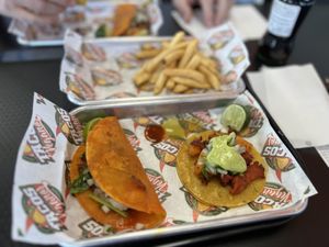 Al Pastor taco, birria taco & French fries   at Tacos Veganos II Avondale   in Avondale