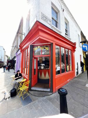 Exterior with outside seating at Trampoline Cafe in North London