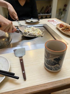 The vegan okonomiyaki cooking in front of you    at Abeno in London