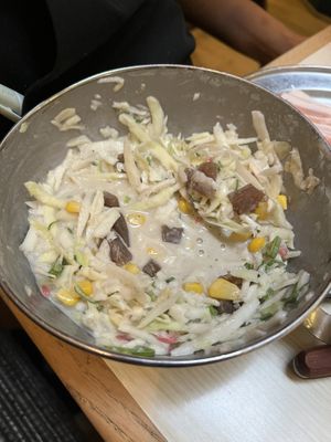 Vegan okonomiyaki mix with konyaku yam, seaweed stock, sweetcorn, pickled ginger, cabbage, green onion, etc brought to the table and mixed in front of you before cooking    at Abeno in London