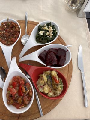 Vegan Meze selection - tomato, hummus, aubergine, sea samphire , beetroot  at Dalyan Ceyhan Restaurant in Mugla