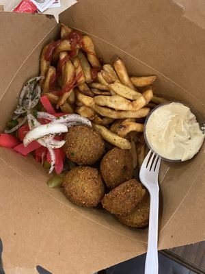 Falafel balls, hummus, fries, and some pickled veggies   at YYZ - Paramount Fine Foods - T1 in Mississauga