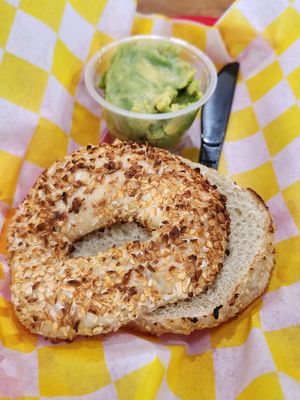 Onion ans garlic bagel and avocado at Galveston Bagel Company in Galveston