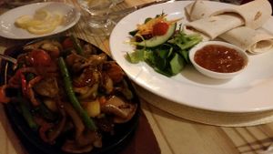 Mixed Vegetable Tikka Sizzler with tortilla wrap, mango chutney and salad at Playwrights in Coventry