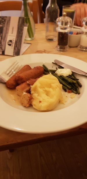 Vegan herb sausages, mash, Ben's, onion gravy and requested extra vegan garlic mayo at Playwrights in Coventry