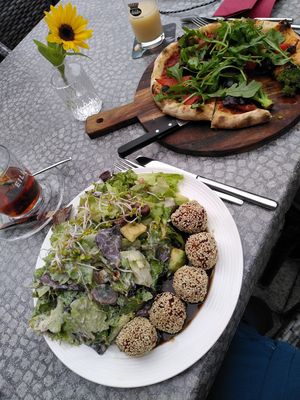 Salad with carrot balls and Mediterranean pizza at Vegane Gastrothek Charisma in Radolfzell