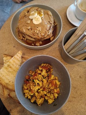 Peanut butter & banana pancakes, tofu scramble. at GAL Cafe in Lisbon
