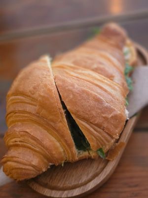 Croissant with marinated tofu, rucola and olives. at GAL Cafe in Lisbon