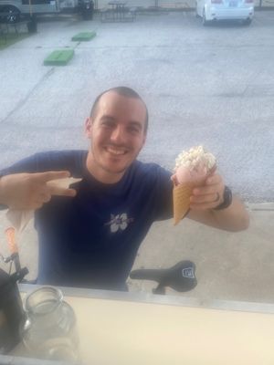 Happy Customer (strawberry, vanilla ice cream in a gf waffle cone topped with vegan whipped cream)  at Chilled Coco in Katy