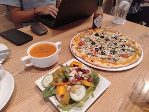 Spiced carrot soup, cranberry pumpkin salad and turkey pizza at WellSmoocht in West Singapore