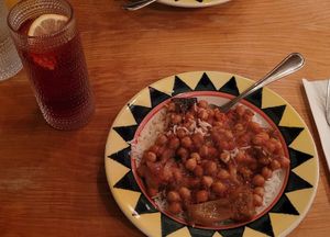 Egyptian stew over rice and vodka hibiscus lemonade at Poppi's Anatolia in Eugene