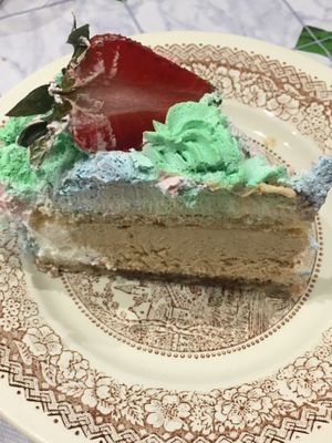 Unicorn cream cake with rum cream inside  at Ratatouille in Turin