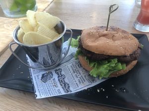 Veggie black bean burger with slated chips  at Santos Coffee With Soul in Oranjestad