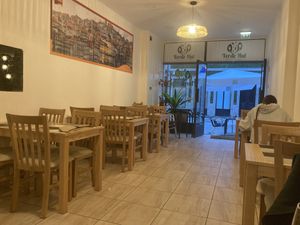 Inside and outside tables  at Verde Hut in Porto