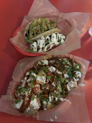 Breakfast taco, cheezy potato taco, nachos with added chorizo seitan  at Taco Party in Somerville