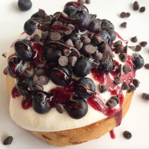 Orange Frosting, Blueberries, Chocolate Chips, and Raspberry Jam! at Cinnaholic in Tucson