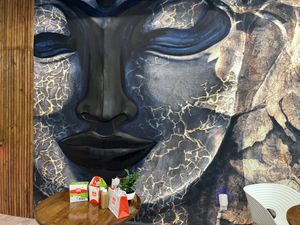 They have a GIANT BUDDHA protruding out the wall.   at Stir House - Vegan Stir Fry in Atlanta