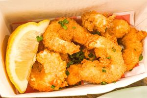 Vegan Shrimp battered to perfection, made of Konjac Root (Asian veggie that assists w/ gut health). This dish is a winner!!! Get it with the Mongolian sauce or Red Pepper Aioli!  at Stir House - Vegan Stir Fry in Atlanta