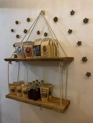 Sells coffee and other packaged goods  at Cachimba in Minca