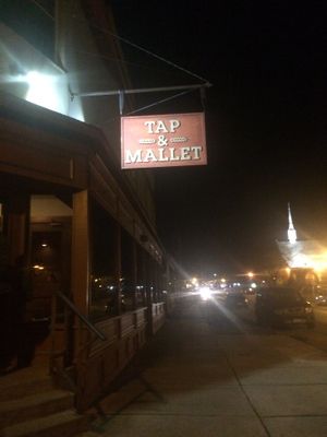 Outside at night, looks closed but is actually open at Tap and Mallet in Rochester