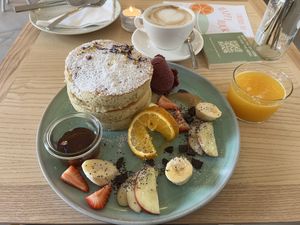 Pancakes, cappuccino and fresh orange juice  at Good One Café - Schanze in Hamburg