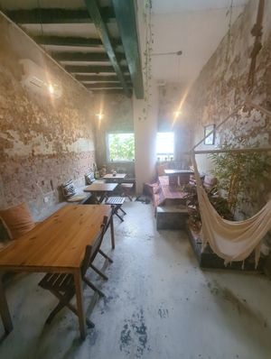 Beautiful cafe on the riverside with indoor and outdoor seating and a separate vegan menu at Vspace Guesthouse and Cafe in Malacca