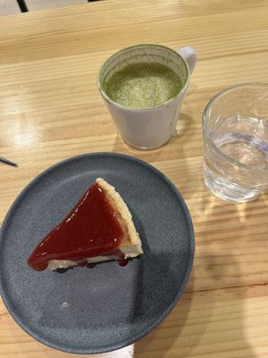 Cheesecake with Strawberry and matcha latte   at Asante in Barcelona