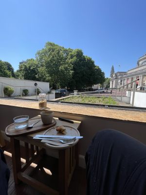 View from inside the café, out towards the museum.  at Oat and Bean in Cardiff