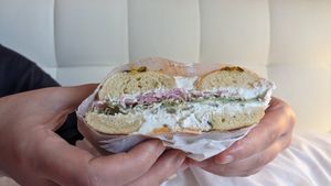 Ridge runner on a jalapeno cheddar bagel, cranberry sauce on the side. So good! at Bavarian Bagel Co in Leavenworth