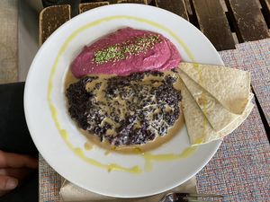Beetroot hummus, vegan creamy black rice dish and pita breadd  at Vert & Frais in Madrid