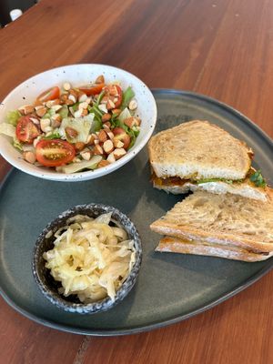 Ananda Sandwich in Sourdough Bread with side leaves salad & pickled veggies. at Blessings Home & Café in Koh Phangan