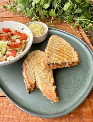 Pizza Toasty in Sourdough Bread with Leaves Salad & Homemade Pickles  at Blessings Home & Café in Koh Phangan
