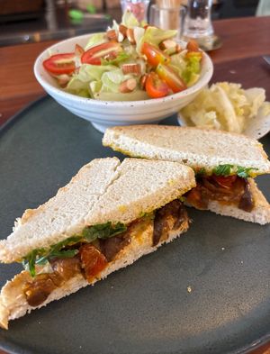 Eggplant sandwich with green salad + almond vinaigrette dressing  at Blessings Home & Café in Koh Phangan