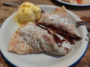Strawberries and dark chocolat with mango ice cream at Crêperie La Rue in Madrid