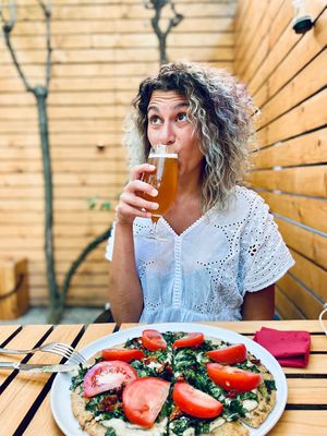 Mediterranean pizza and beer in the garden   at Soul Kitchen in Sofia