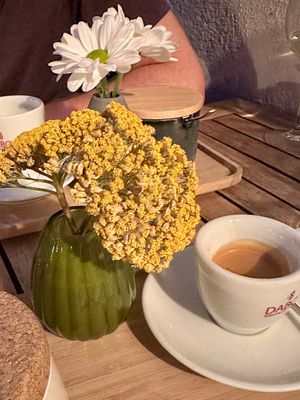 Coffee served with decorative flowers  at Soul Kitchen in Sofia
